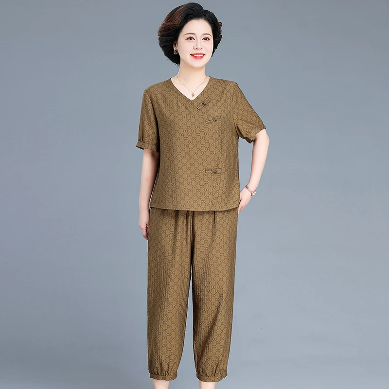 

Новая китайская летняя футболка из хлопка и льна с коротким рукавом для женщин среднего и старшего возраста, удобная, свободного кроя.