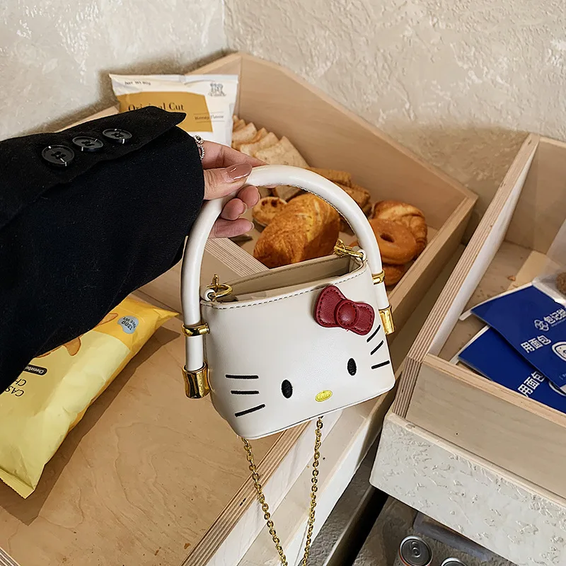 

Детская сумка Sanrio, новая, милая, с вышивкой в виде котёнка KT, высококачественная, универсальная, для девочек, сумка через плечо для родителей и детей, сумка для помады.