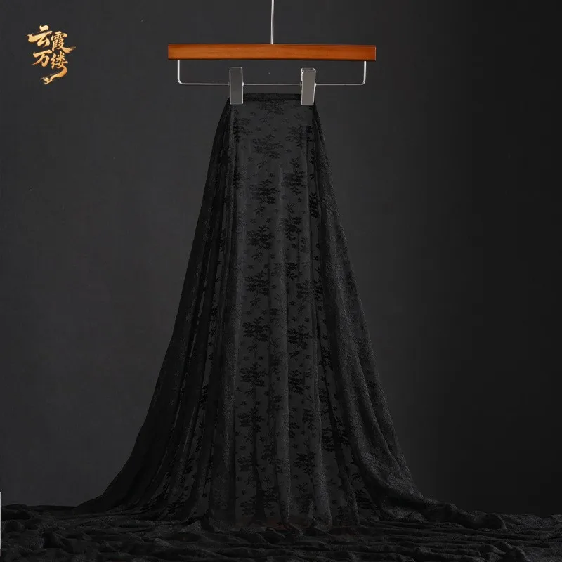 Black and white lace fabric can be cut into embroidered mesh for the hem of a dress It is designer's