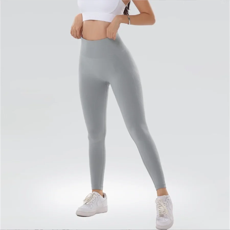 Tuta fitness yoga senza cuciture in tinta unita per capispalla, vestibilità a vita alta e snellente, leggings sportivi a forma di pesca e sollevamento fianchi