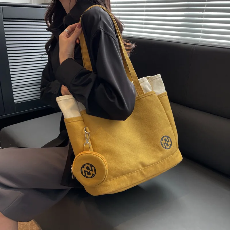 Large capacity female 2023 new tide leisure canvas bag contracted the van single shoulder students book tote bags