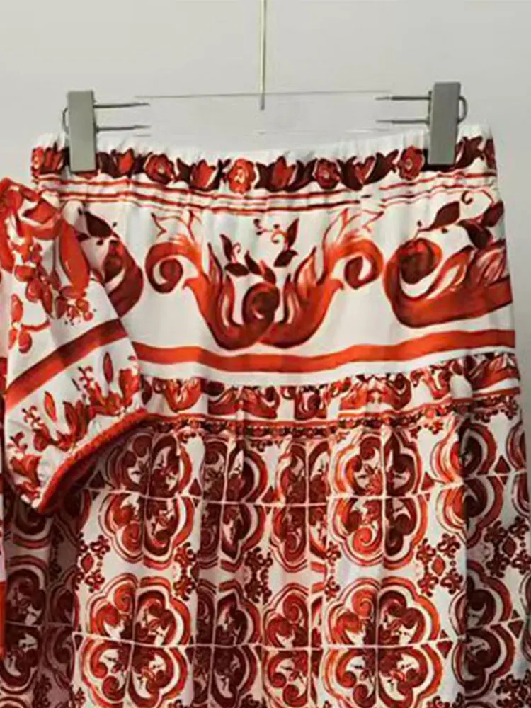 In the summer of 2026, the new women's suit printed with one-word collar, short sleeves, short blouse, high waist and big skirt