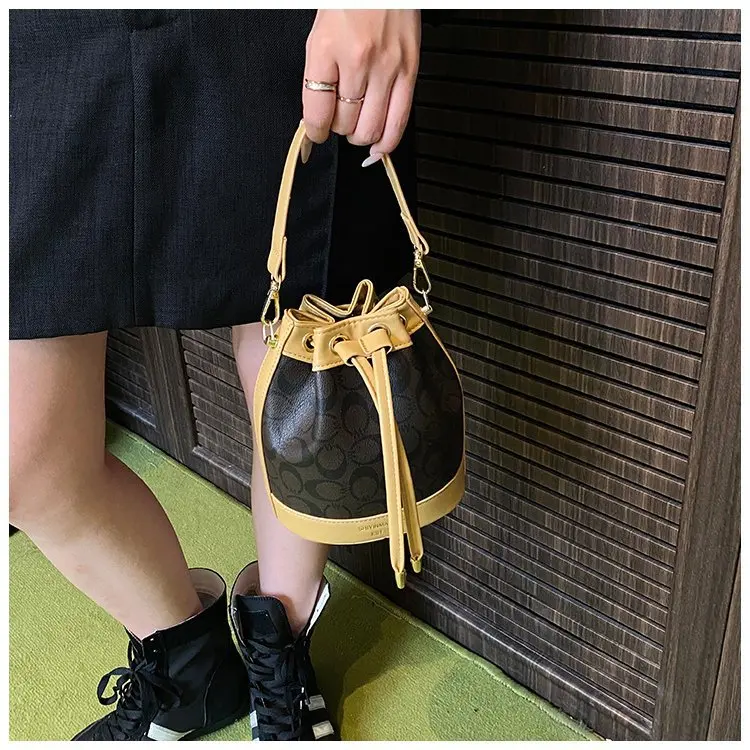 

Vintage Bucket Bag with Chain-Strap - Signature Print Drawstring Purse, Designer Inspired Commuter-Ready Tote