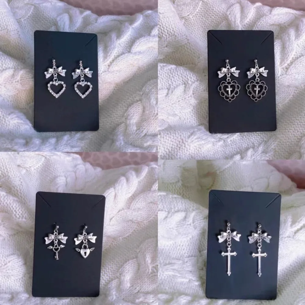Image of Temperament Süße Silber Farbe Bowknot Kreuz Ausgehöhlte Herz Form Strass Baumeln Ohrringe für Frauen Gothic Y2K Schmuck