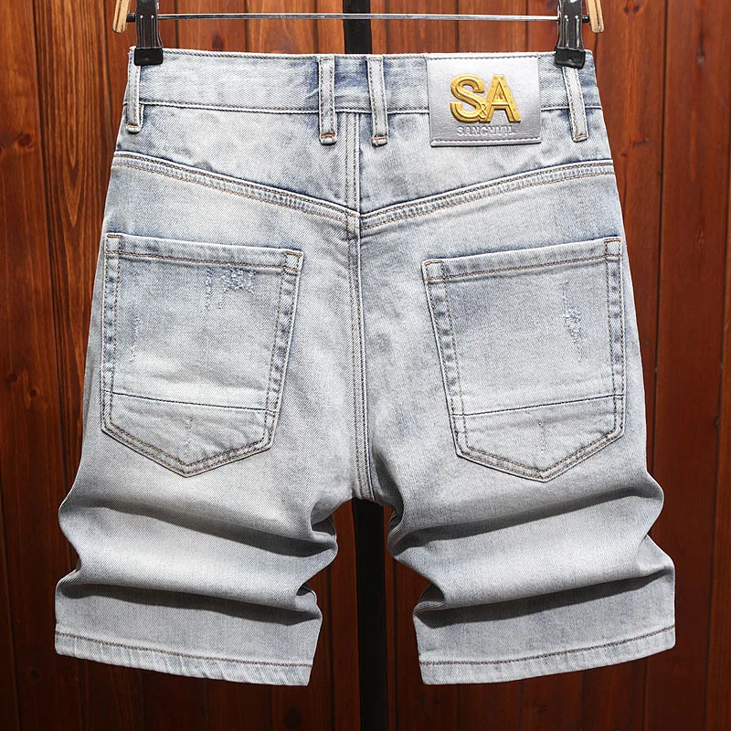 High end trendy men's denim shorts with men's stretch hole patch, summer trend washed five quarter horse pants