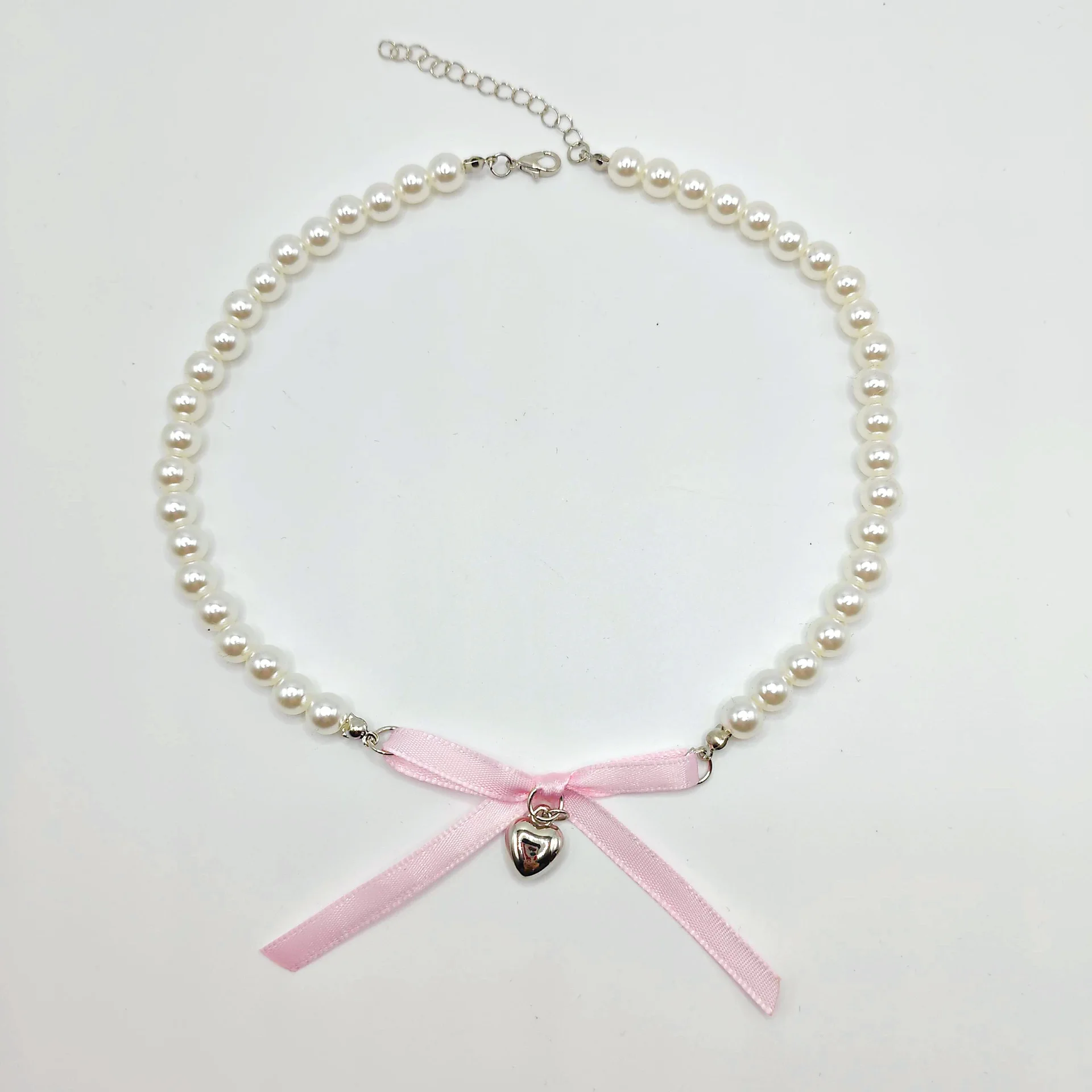 الطريق الأيمن الجديد الراقية تصميم درجة الحرارة المتخصصة شيك النمط الفرنسي الحب اللؤلؤ القوس الشريط قلادة للنساء