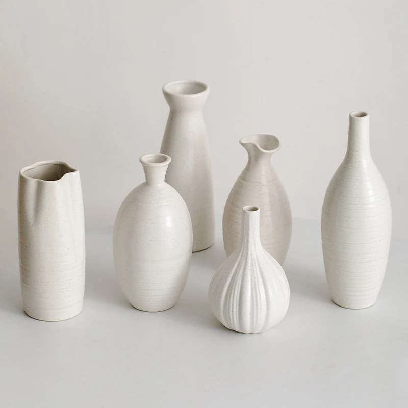 

Retro Nordic white minimalist ceramic vase - ideal for creating a creative flower arrangement in the living room.