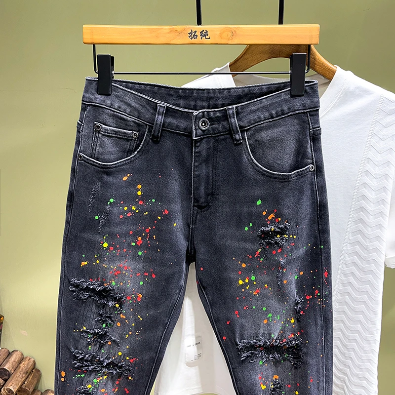 2024 spring and summer trend of fashion printing spray paint jeans men's Slim small straight leg pants personalized hole pants