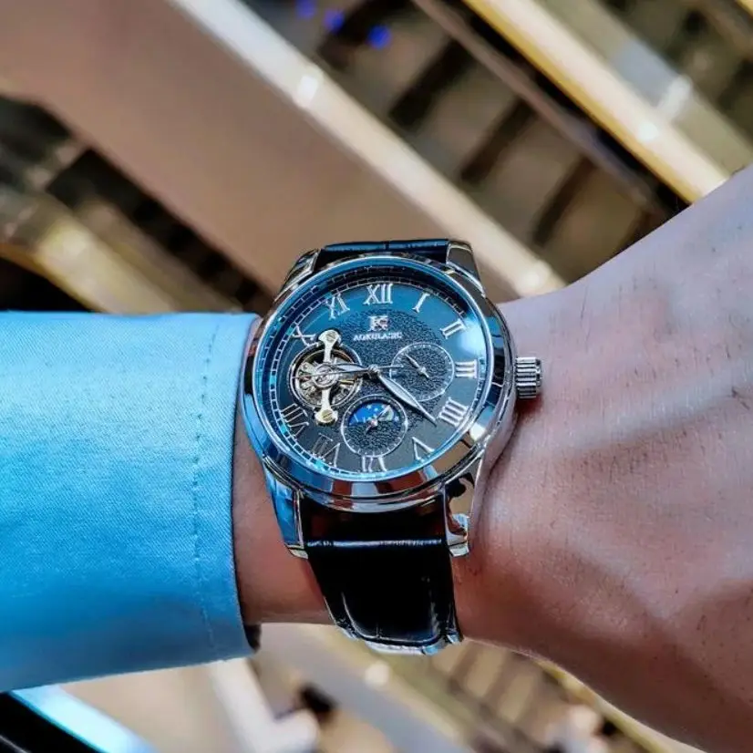 

Высококачественные деловые мужские механические часы в европейском и американском стиле, римские цифры, круглый циферблат, автоматический заводной, скелетонизированный дизайн, кожаный ремешок, многофункциональный дисплей с дополнительным циферблатом, элит