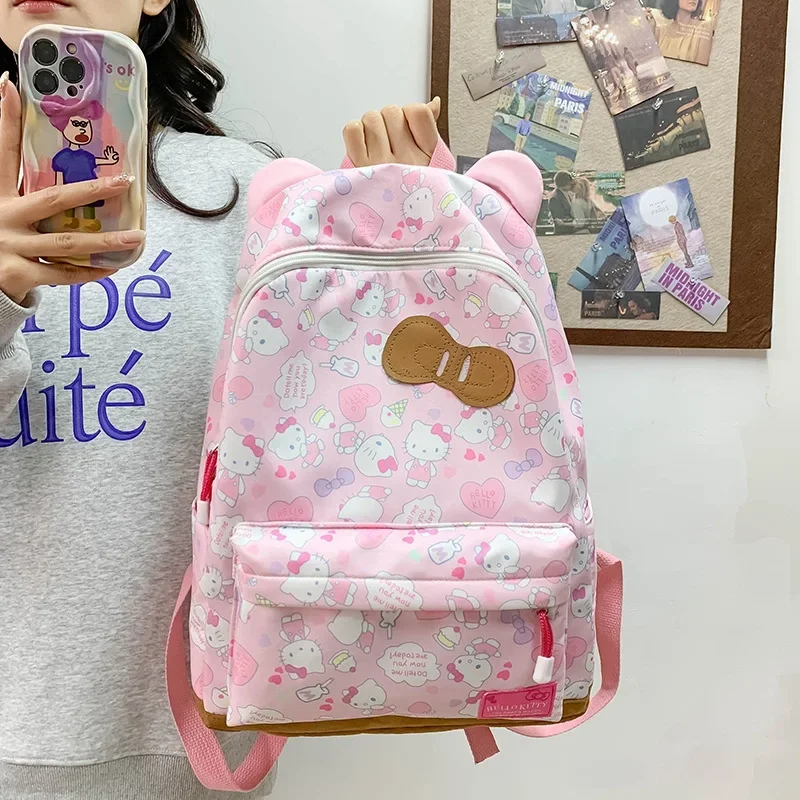 Sanli cartoon animation KT cat bow schoolbag casual backpack female commuter oblique span cute cat ear large capacity backpack