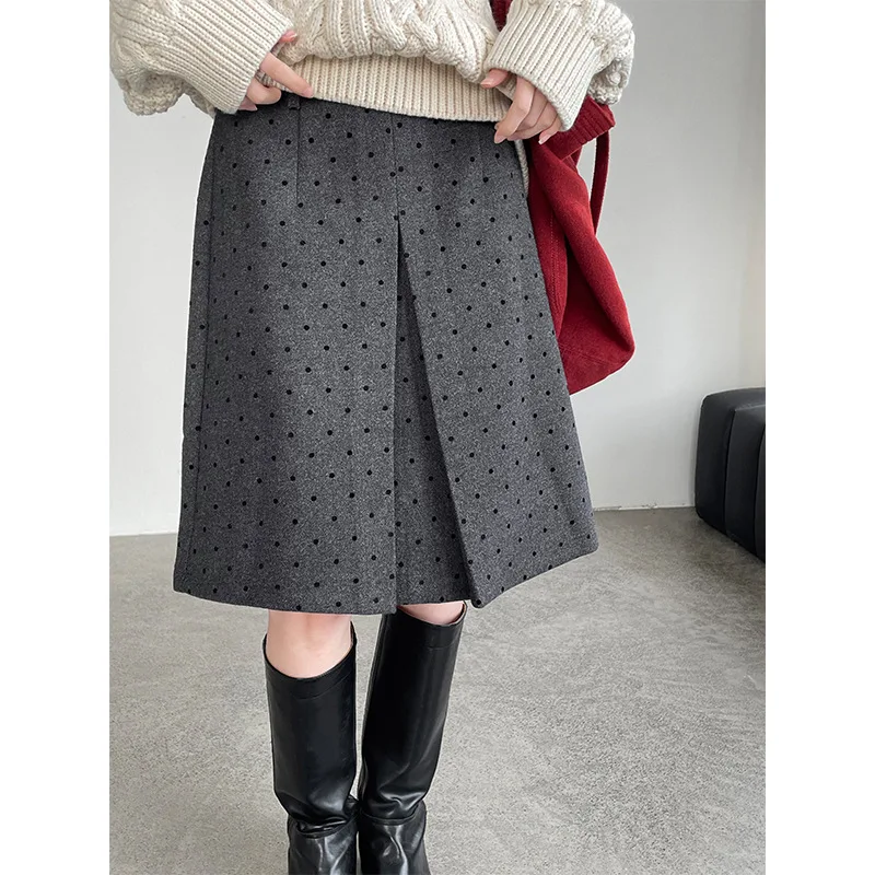 Jesienno-zimowa koreańska spódnica wełniana w stylu retro w grochy, pogrubiona, do połowy łydki, podkreślająca temperament.