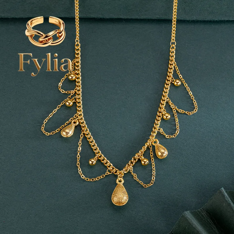

Fylia Jewelry 9999 24K real gold water drop lace chain gold necklace for women tassel hollow chain design pendant 5G brushed c