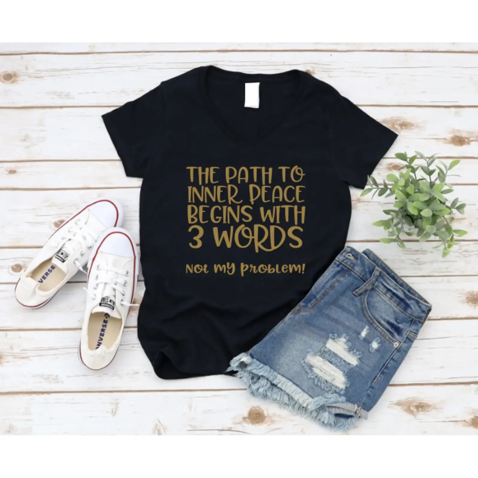 Black t shirt with gold text on a wooden surface shoes and shorts www missmafia com vintage Washed Breathable Soft fashion