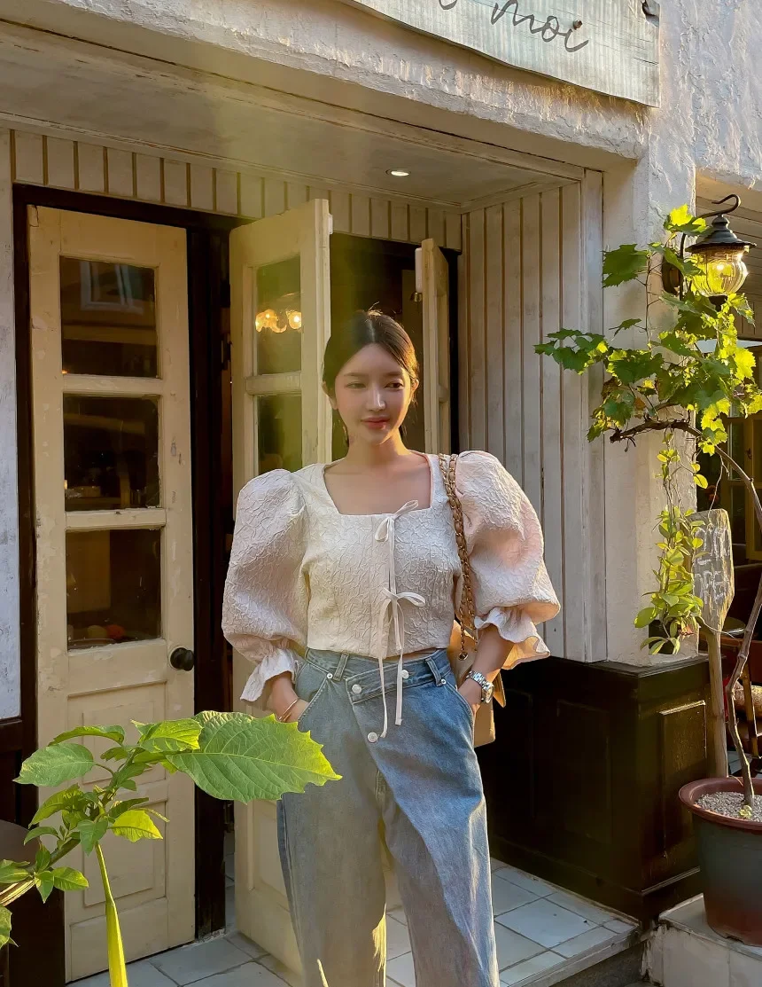 Jeans de cintura alta feminino com fivela diagonal irregular, calças de perna larga, chique coreano, primavera