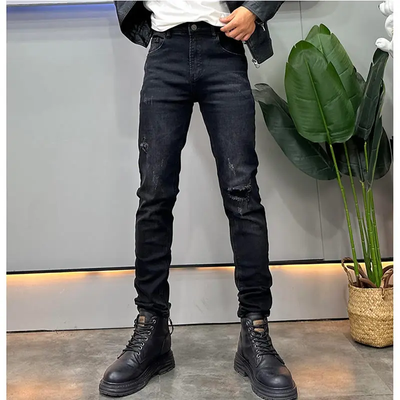 カウボーイデニムブラックフェイクリップドジーンズメンズトレンドブランド秋冬2025新作ファッショナブルな伸縮性スリムスキニージーンズパンツ男性用