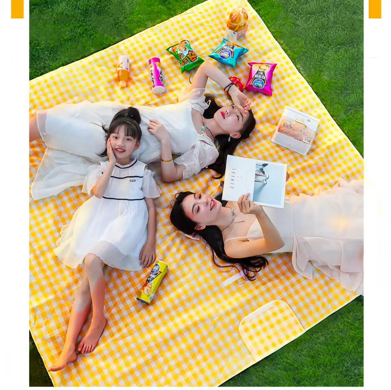 Family Waterproof Picnic Mat Family relaxing on a large yellow waterproof picnic mat in a park