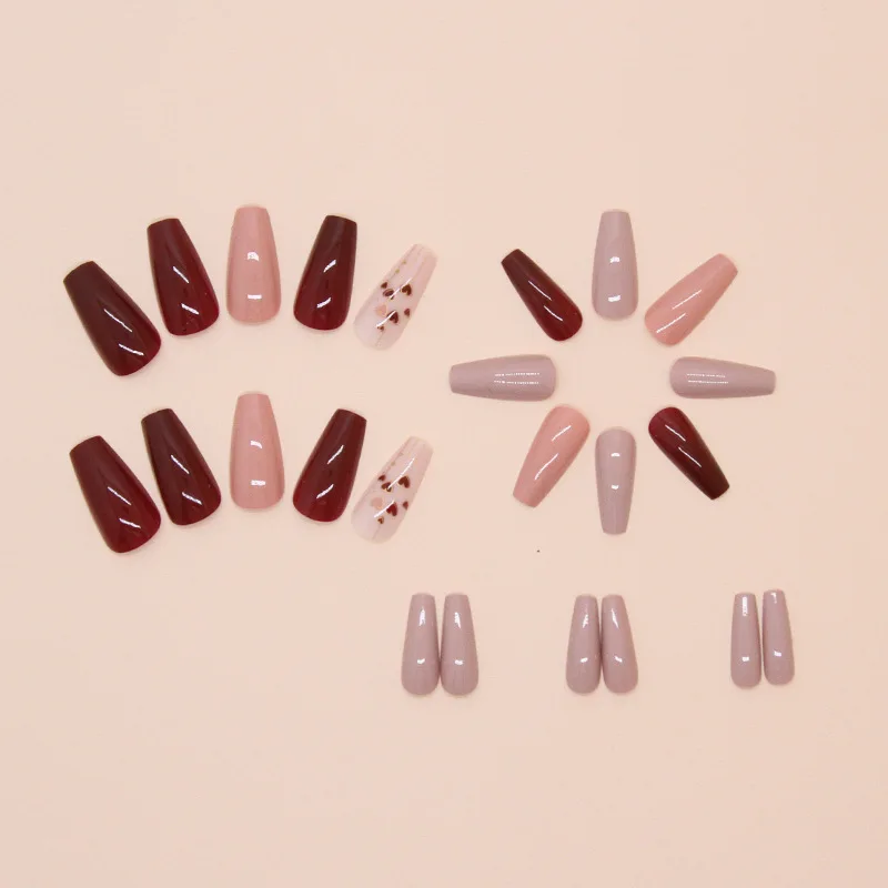 A full set of 24 long coffin-shaped fake nails with solid color fake nails and a heart design, including 1 jelly glue and 1 rub