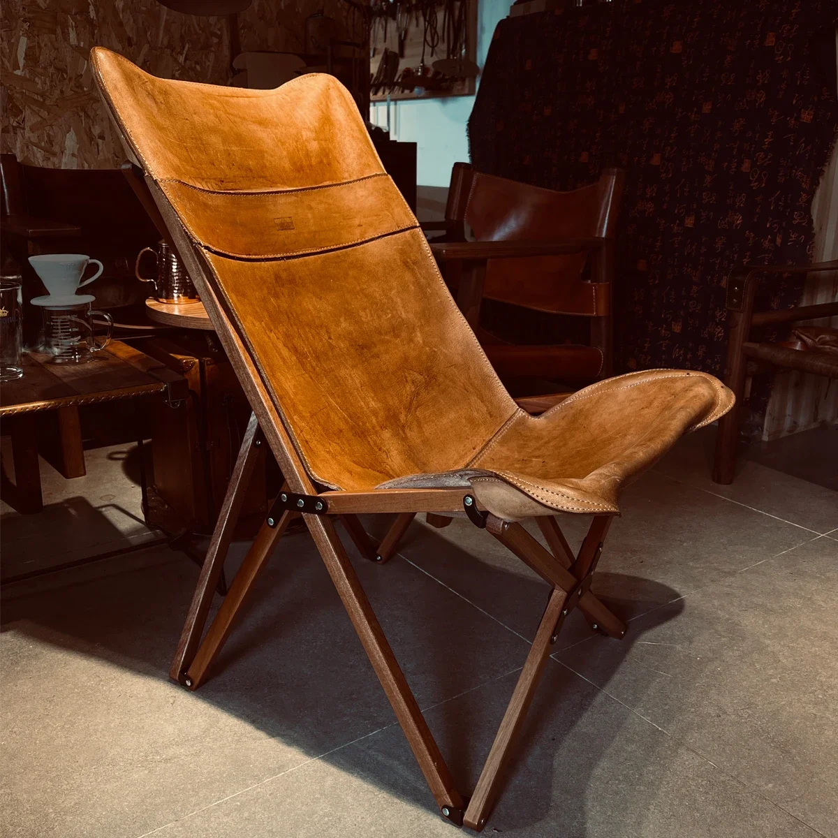 Chaise papillon camping bois massif peau de vache pliante