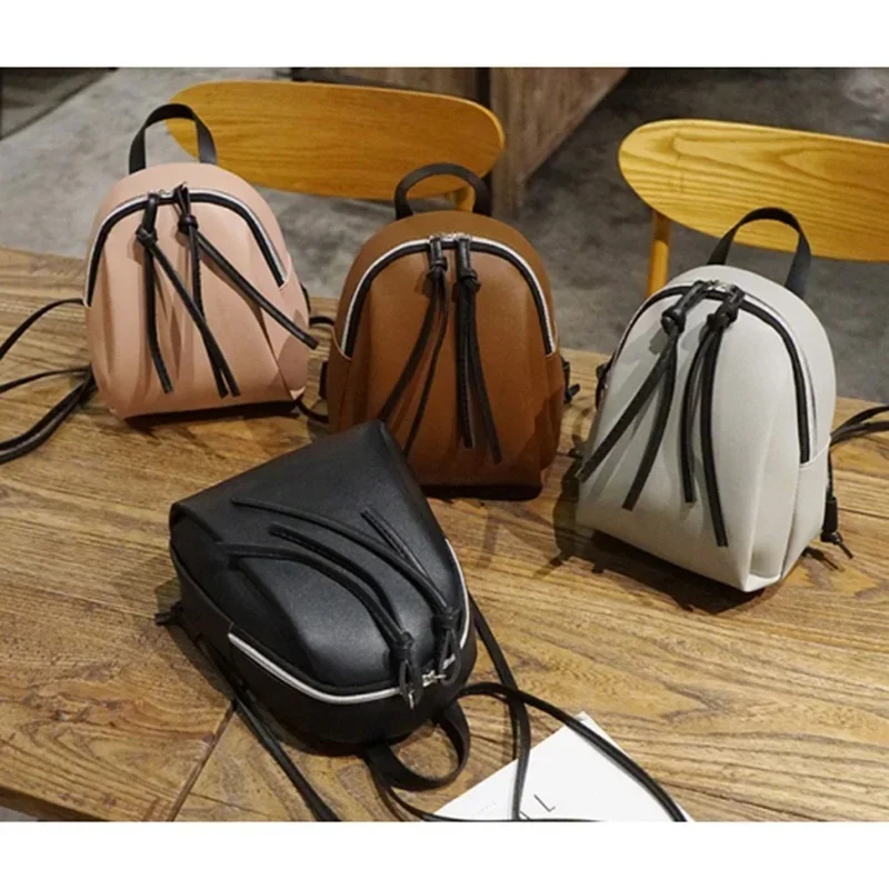 Mini mochila de couro PU para mulheres, bolsa de ombro pequena com borla zíper, mochila escolar feminina para adolescentes