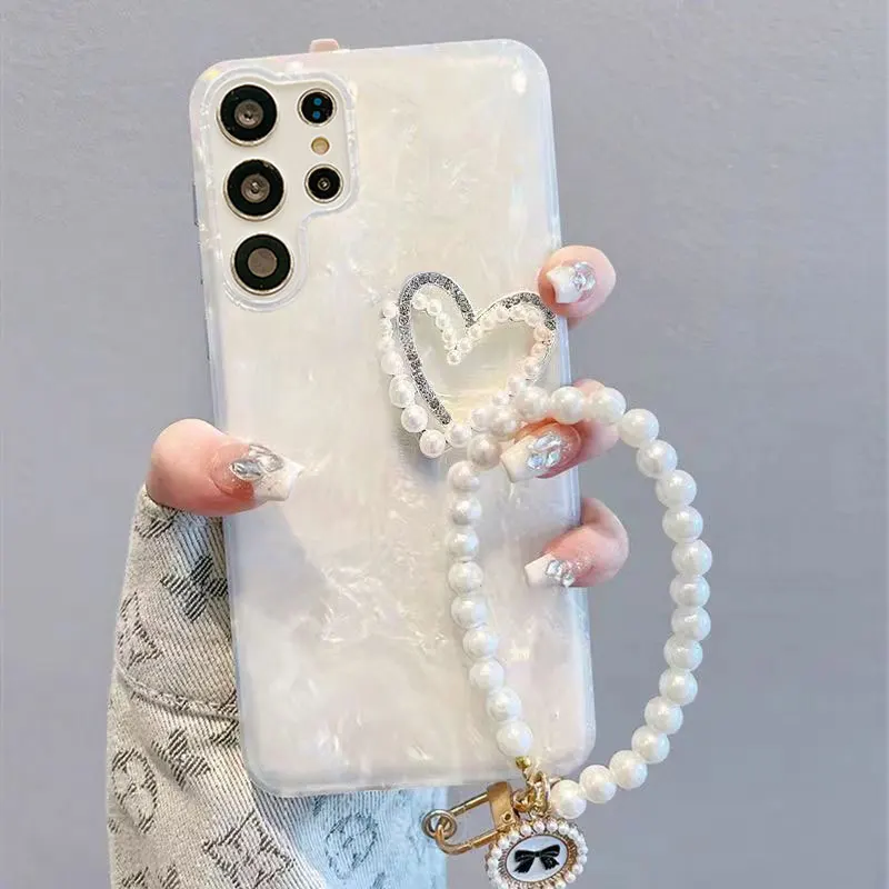 

S 24 Luxury Pearl Heart Wrist Strap Case for Samsung Galaxy S24 S23 S22 Ultra S21 Plus S20 FE A54 A34 A53 A55 A15 Lanyard Cover