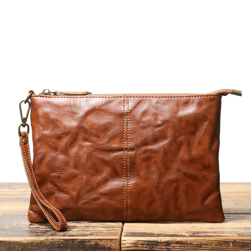 

New Retro Handmade Men's Genuine Leather Handbag with Cowhide and Large Capacity IPad Bag, Hand Grip Pattern File Wrist Bag