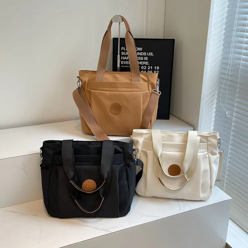 Sac fourre-tout en toile pour femme, sac à main à bandoulière, grande capacité, fermeture éclair et poches, nylon, décontracté, mode initiée