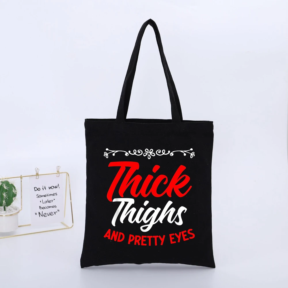 Thick Thighs AND PRETTY EYES Slogan-Style Black Canvas Tote Bag, Streetwear Style for Daily Shopping and Casual Outings