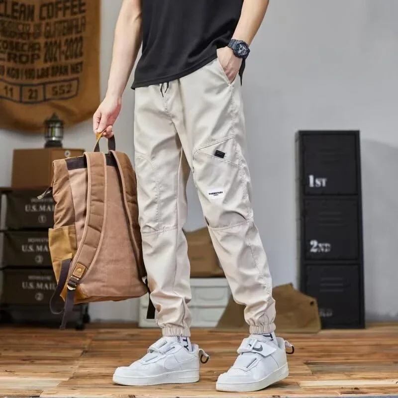 

Hot Sale Korean Outdoor Sports Pants 2025 Men Four Seasons Casual Pants Male Loose With Handsome Straight Leg Bound Feet Pants