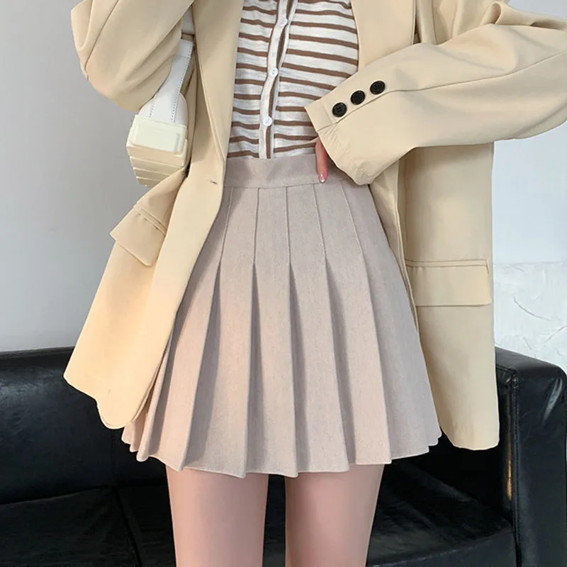 Faldas acampanadas de cintura alta coreana para mujer, Falda plisada de lana gruesa de estilo universitario, minifalda ajustada que combina con todo de Color sólido