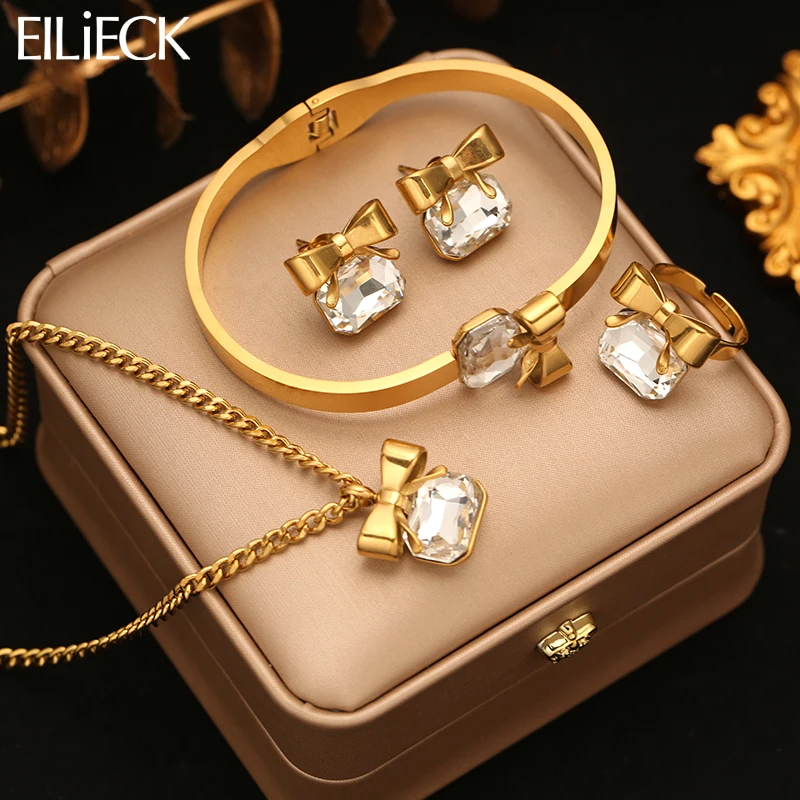 

EILIECK Golden Stainless Steel Metal Bowknot Sparkling Crystal Necklace Bangle Earrings Ring Trendy Jewelry Set For Women Gift