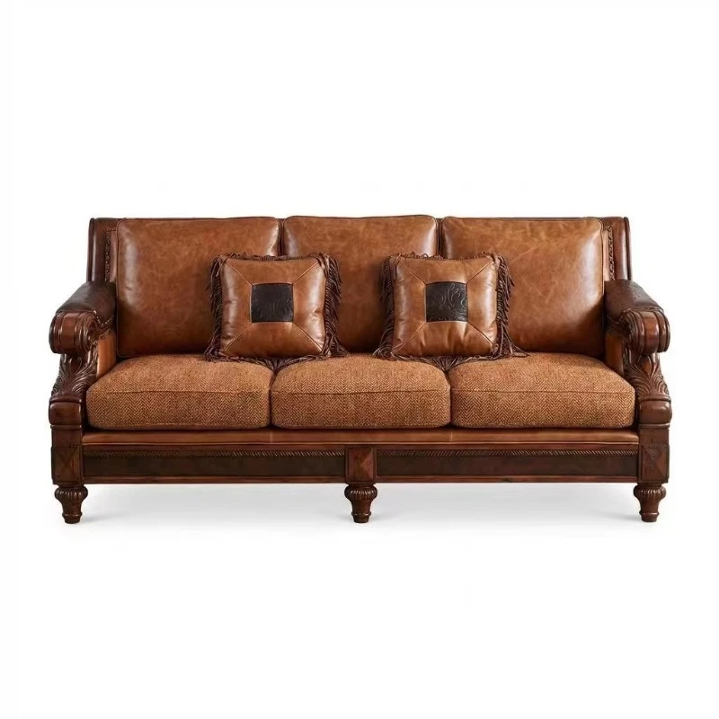 Leather and herringbone sofa combination with curled engraved armrests