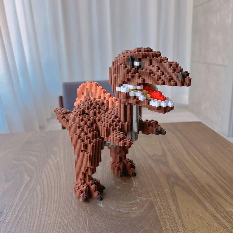 Blocos de construção de partículas pequenas brinquedo dinossauro spinosaurus triceratops bloco de construção diy quebra-cabeça meninos meninas série ornamento