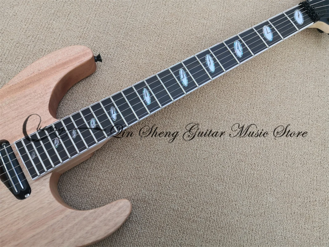 7-string electric guitar, matte mahogany body, maple wood, black tremolo bridge, two-track pickup