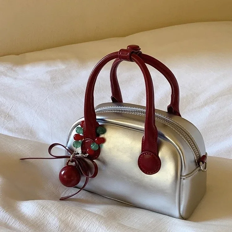 Silver Commuter Shoulder Bags Women Luxury Designer Handbags with Red Ball Pendant Causal Bag Large Capacity Pillow Underarm Bag