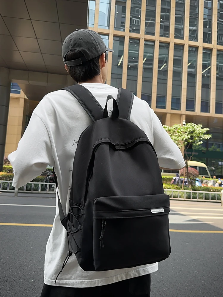 Multifunctional backpack men's fashion backpack simple solid color student bag large capacity short-distance travel bag.