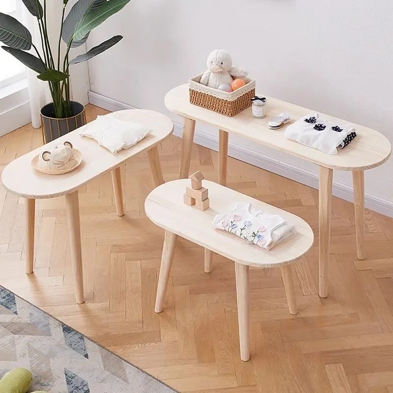 In the middle of the table in the clothing store, there are Internet celebrity solid wood display tables, children's clothing st