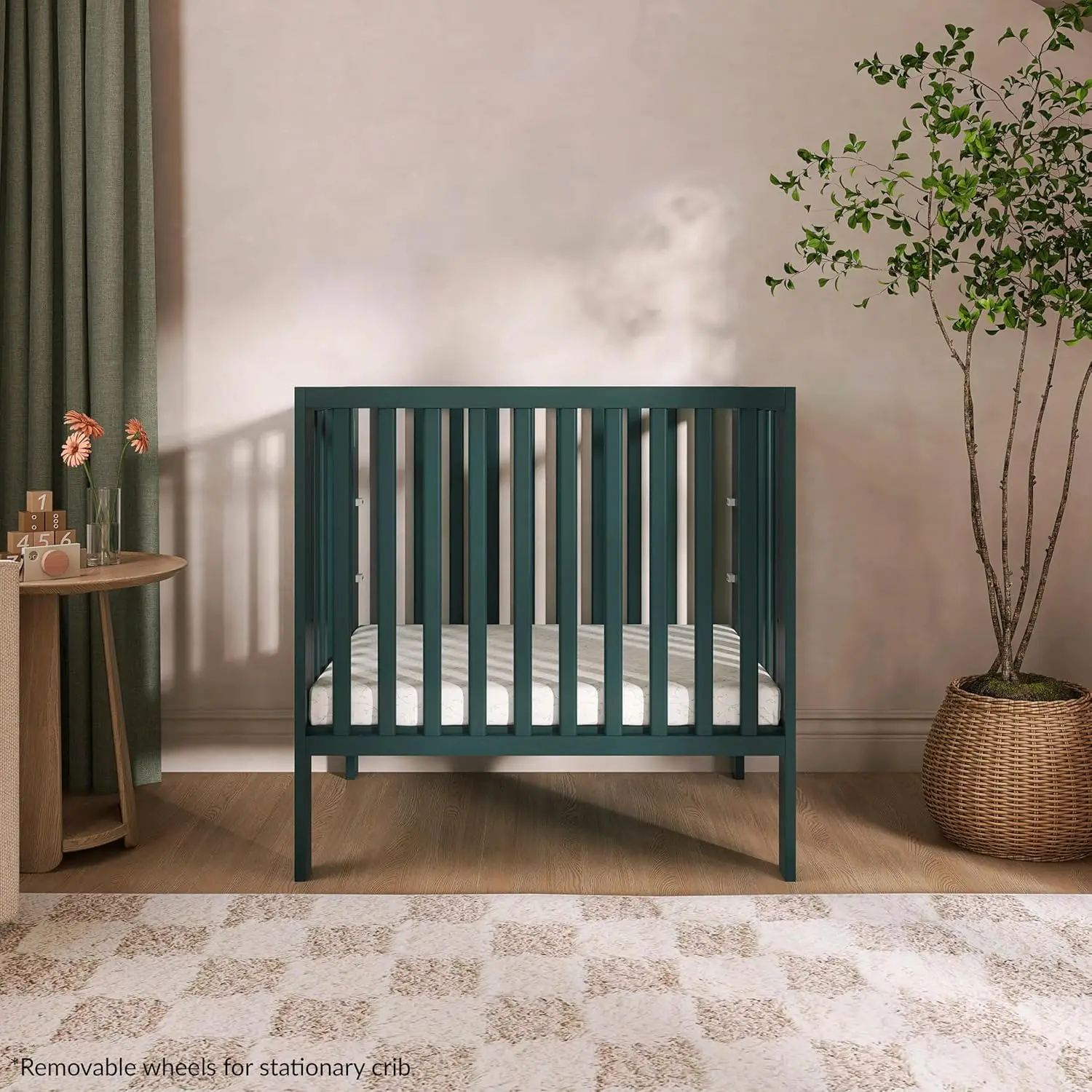 Portable Mini Crib with Flat Folding System, Lightweight for Travel, Adjustable Heights & Safe Wheels