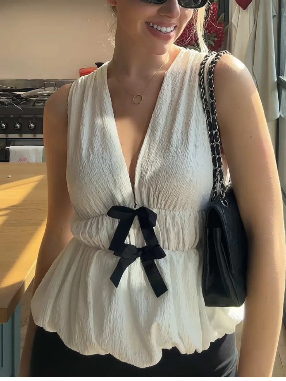 

Women's autumn new simple deep V-neck bow edge textured casual slim top commuting elegant elastic waist sleeveless short top