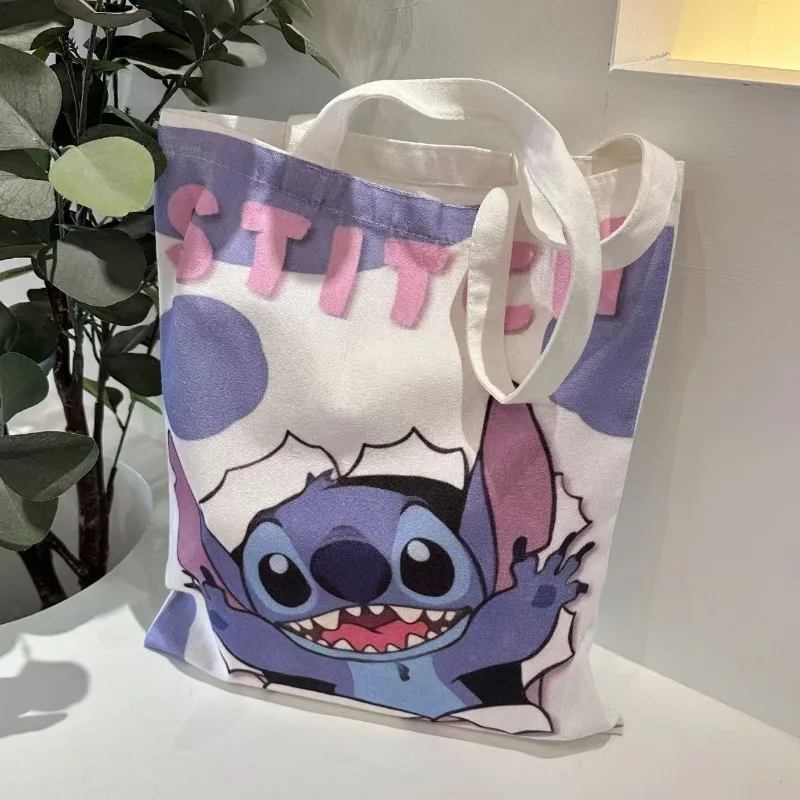 Bolso de lona de Disney Lilo & Stitch para niñas, bolso de hombro con dibujos animados, bolso informal de gran capacidad para compras diarias, novedad de 2026