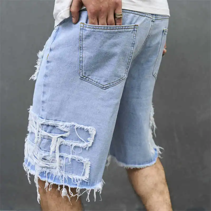 Nieuwe herenjeans met gaten zijn losse trendy herenshorts, casual shorts en cropped broeken voor heren