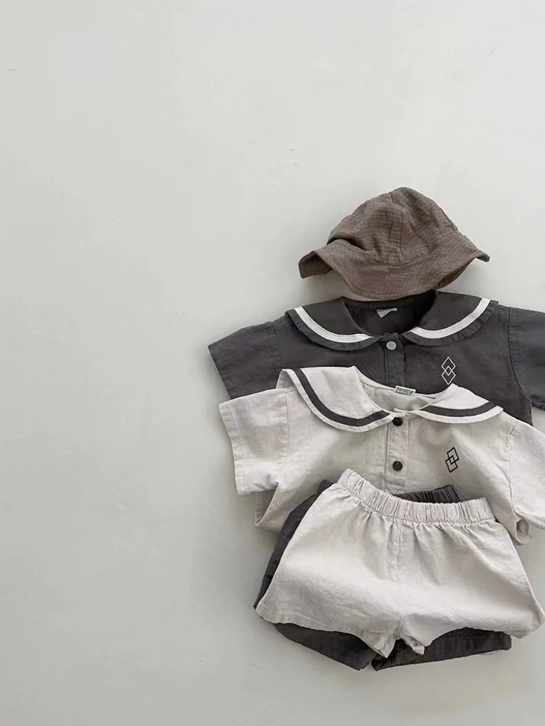 Conjunto de ropa de manga corta para bebé, pantalones cortos informales para niño y niña, traje de cuello azul marino con patrones geométricos,