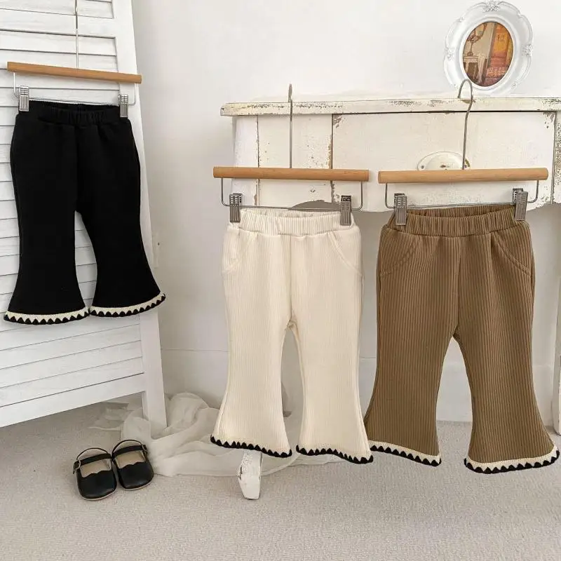 2025 invierno nuevos pantalones cálidos de lana para bebés niñas más pantalones acampanados gruesos de terciopelo pantalones sólidos para niños