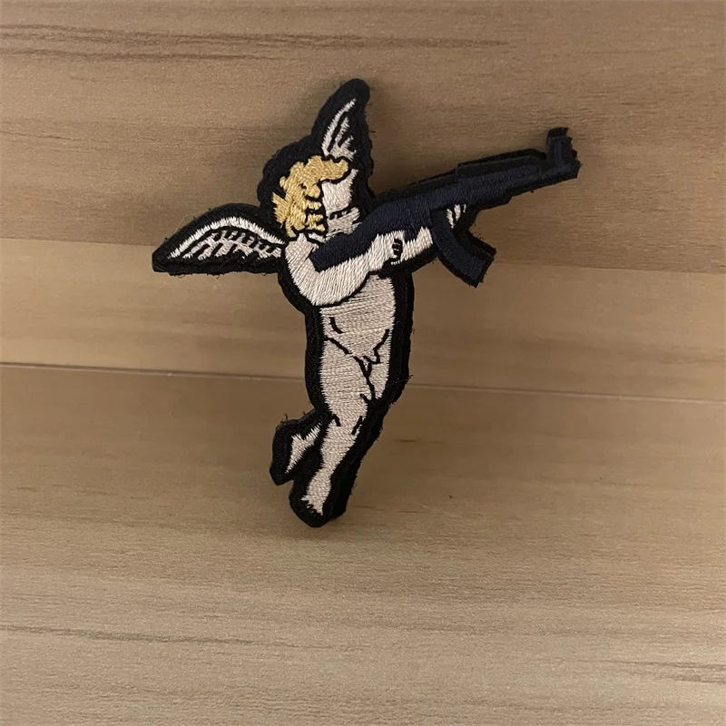 

Cupid and Gun Tactical Patches on Clothes Hook and Loop Embroided Appique Military Angel Morale Badge Armband Backpack Stickers