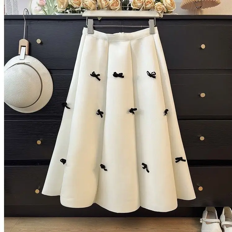 Autumn and winter new sweet bow skirt women's high waist thin A word big swing umbrella skirt medium and long thin cover meat