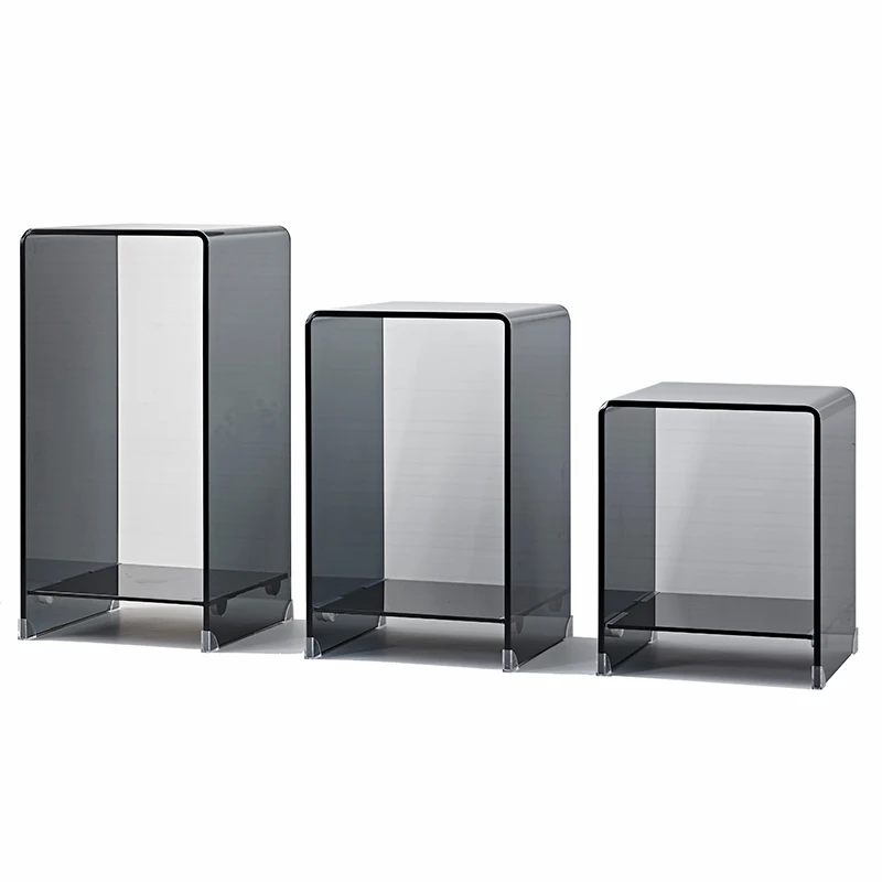 

A few square tables next to the sofa in the living room, a glass corner table, a bedside table, small table,and coffee