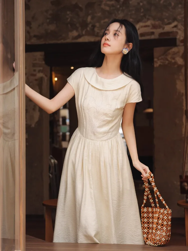 Elegante retro geborduurde jurk getextureerde zomer a-lijn maxi zonnejurk dames korte mouw vloeiende jurk lelie bloemen detail terug stropdas