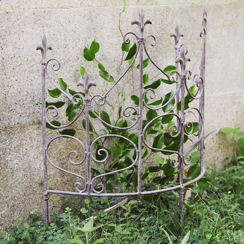 Vintage gardening fence, ironwork, distressed garden decoration, hydrangea tractor, clematis climbing gardening fence