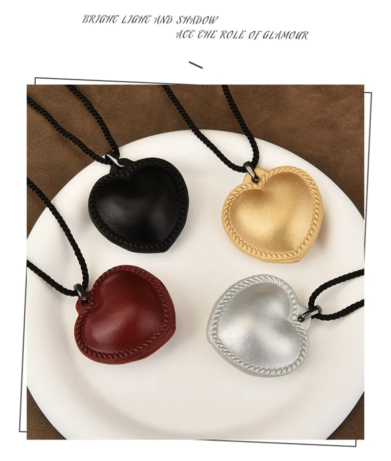 

A vintage leather sweater necklace and a popular brown heart-shaped necklace