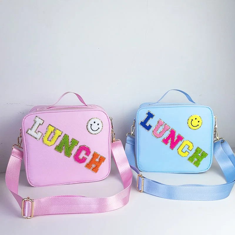 Popular nylon embroidered smiling face lunch bag with letter stickers hand-held picnic bag, outdoor portable insulated bento bag