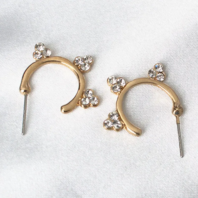 New Design Austrian Crystal Gold Color Sun Flower Earrings For Woman 2026 Popular Rhinestone Semicircle Curved Stud Earrings